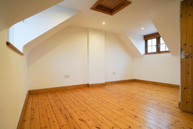 A lovely room of character, with wooden flooring.