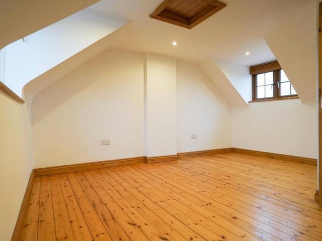 A lovely room of character, with wooden flooring.