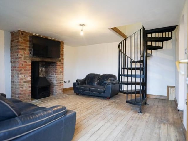 The winding staircase adds to the character of the lounge.