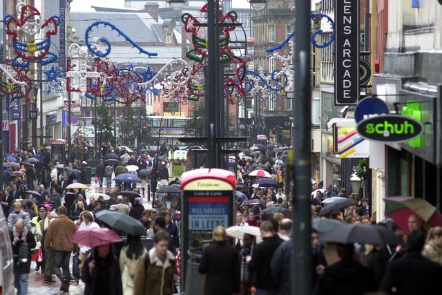 Shoppers braving the weather on Briggate in December 2002.
