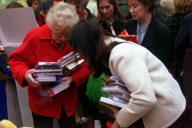 December 1999 and shoppers indulge in the great British tradition of battling to buy next year's Christmas cards.