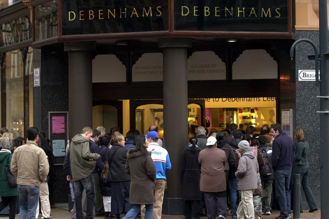 Shoppers wait outside Debenhams for the doors to open for the sales on Boxing Day in December 2003.