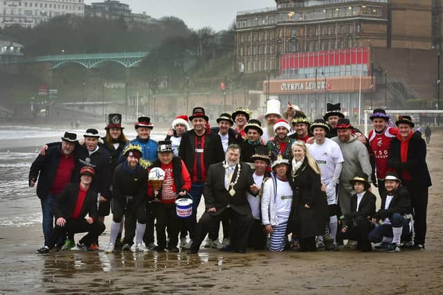 Mayor Eric Broadbent and wife Lynne join the teams on the beach