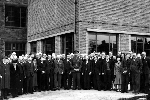 A group photograph showing people present at the official opening of the extension to the council offices in Rothwell in March 1940.