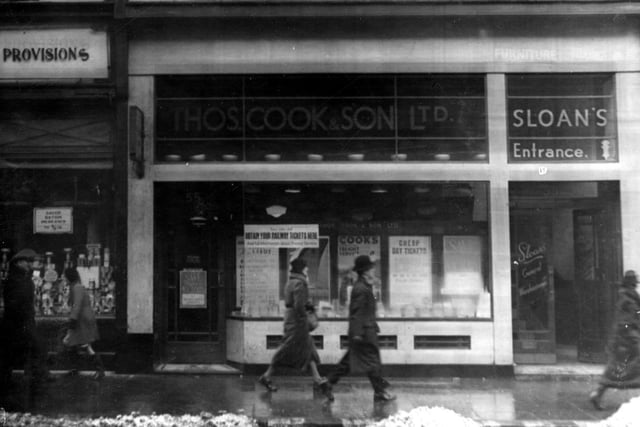 Thomas Cook Travel Office on Boar Lane in February 1940. Entrance to Sloan's general warehouse is visible on the right.