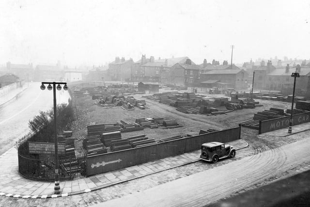 St. James Street in April 1940. Pictured is a view behind Leeds Civic Hall looking north west over a demolished area, previously used as a car park. They stored steel girders for constructing ARP shelters.