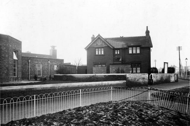 Cross Gates Police Station at the junction of Cross Gates Lane with Station Road in January 1940. It was opened in 1900 and became Leeds City Police property following boundary extensions and used as a section station until 1965 when it was taken over by Social Services; it has now been demolished. On the left is Crossgates Library which is on Farm Road and opened in 1939.