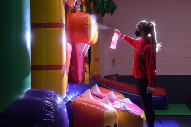 Bounce Play Centre is getting ready to reopen.  Ellie Mercer sprays the equipment down.