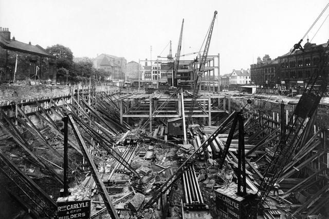 The early stages in the construction of the store in August 1931 which was to occupy a site cleared of old property between The Headrow on the right, New Briggate, straight ahead, Mark Lane to the left, and Woodhouse Lane behind the camera.