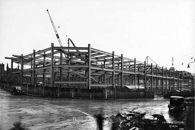 The Headrow at the junction with Wade Lane (left) with the construction of the new Lewis's store well underway in December 1931.