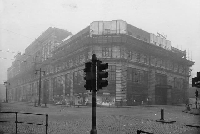 The store from the junction of Briggate and The Headrow during construction of an extra floor on top of building in December 1938.