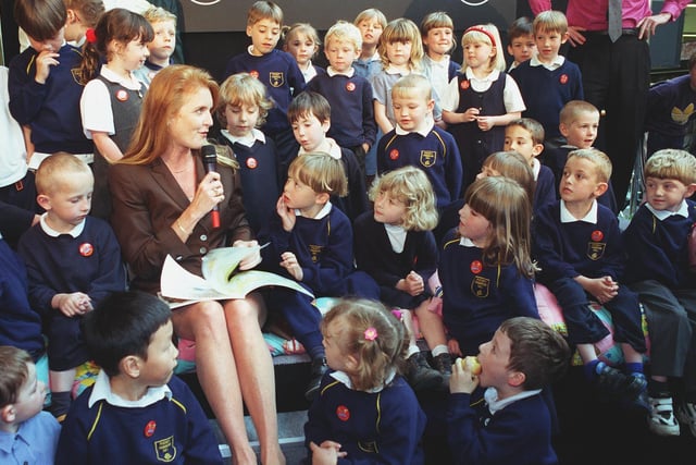 Sarah, Duchess of York, reads to pupils from Primrose Hill Primary during a visit to Asda's Owlcotes Centre store in Pudsey in June 1999.