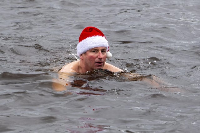 A swimmer keeps the festive spirit alive