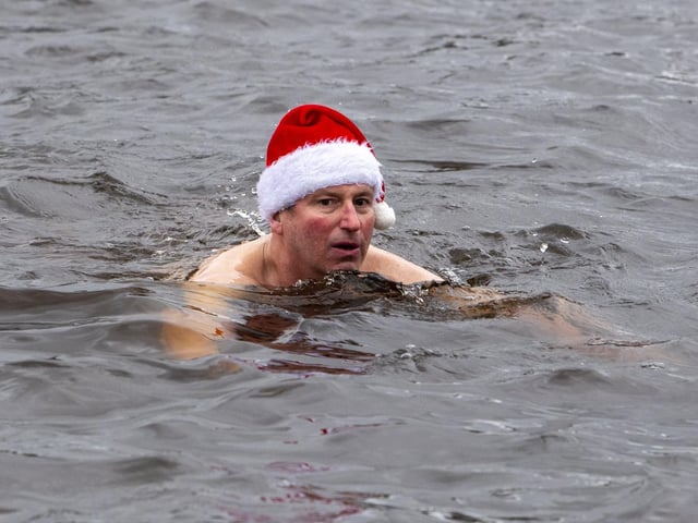 A swimmer keeps the festive spirit alive