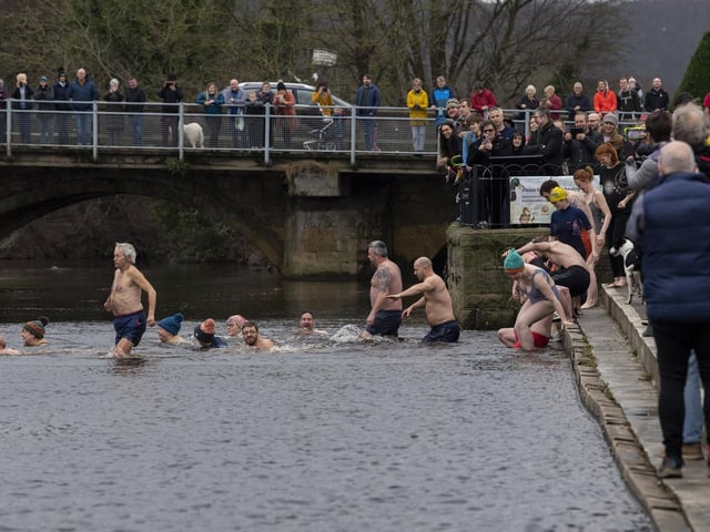 Swimmers enter the water