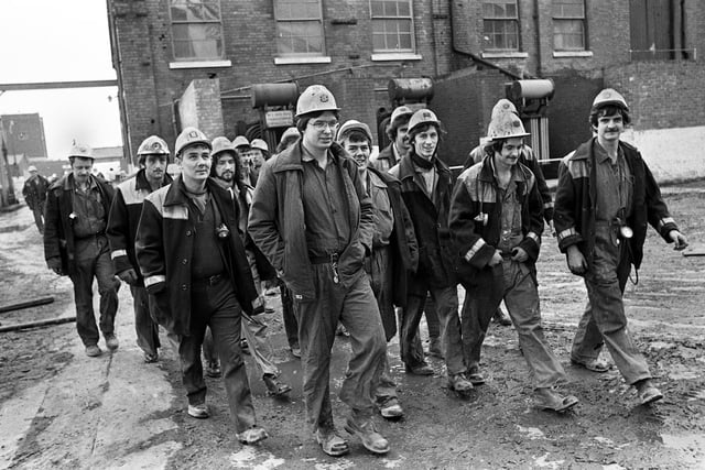 Brave smiles from some of the first miners back to work on Wednesday 21st of March 1979 just 3 days after the underground explosion which eventually killed 10 of their colleagues at Golborne Colliery.