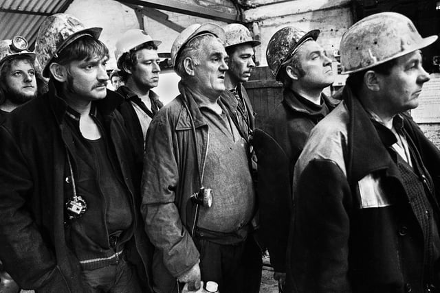 Some of the first miners back to work wait pensively for the cage to take them back underground on Wednesday 21st of March 1979 just 3 days after the underground explosion which eventually killed 10 of their colleagues at Golborne Colliery.  A huge explosion tore down the Plodder seam drivage more than 1,800 feet below the winding gear of Golborne Colliery.  Three men died instantly and a further eight received serious lung and burn injuries. Seven of the eight would later die. The accident was caused by a spark which ignited methane which had built up because of a malfunctioning fan.