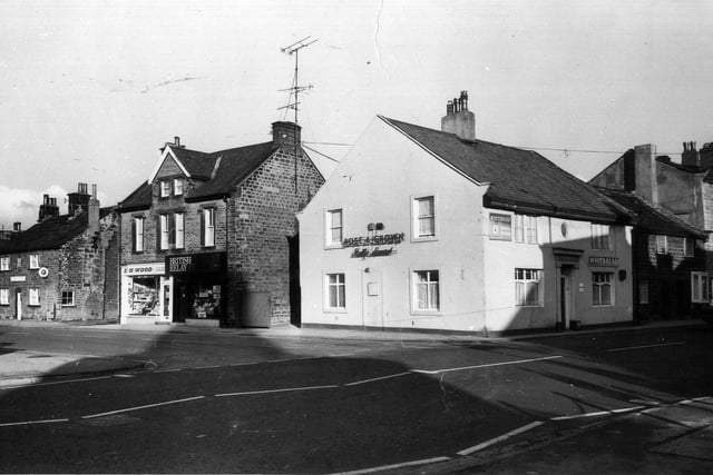 The junction of Bondgate, foreground and right, with Crossgate, left. On the corner is the Rose and Crown public house. Circa November to December 1976.