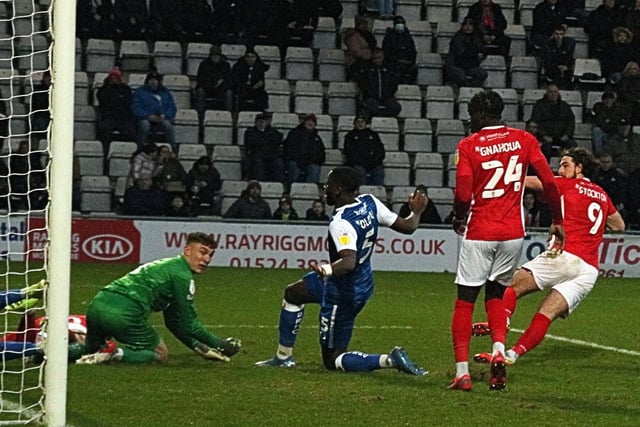 Cole Stockton scores Morecambe's first goal to make it 3-1