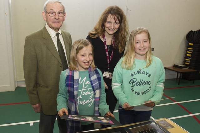 Former head teacher Stan Sudlow and current head teacher Morag McCreadie with twin sisters Zoe and Lucy McGlasson.