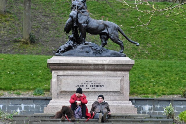 Dog walkers having a rest at the John Stewart Kennedy sculpture.