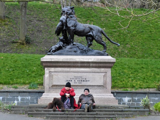 Dog walkers having a rest at the John Stewart Kennedy sculpture.