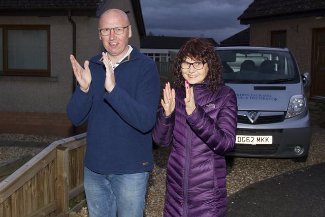 Gordon and Wendy Jackson clap at home in Dounehill, Jedburgh.