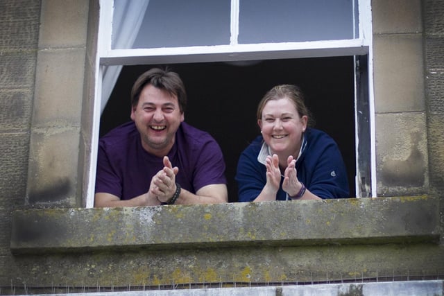 Ian and Angela Blain showing their support from their window at the Square in Kelso