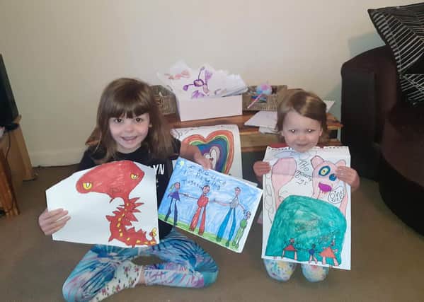 Lily, 6, and Phoebe, 3, Jackson from Hawick with their artistic efforts.