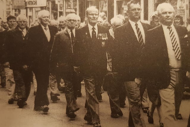 Ex-Servicemen march along Hawick High Street, after the Drumhead service at the Common Haugh.