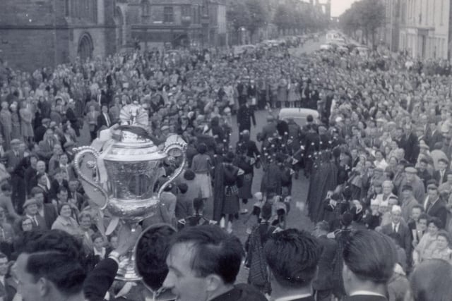 The Scottish Cup winning heroes of 1960 are welcomed back to St Andrews by a large crowd and a pipe band