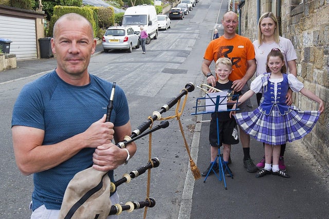 Piper Roddy McIntyre preparing to celebrate the work of NHS, with 9 year Old Highland dancer Ruby and her 7 year old Brother Ivan, proud parents, Lorna and Kevin Watson at Orchard Terrace, Hawick.
