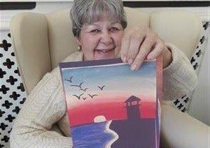 Irene Young enjoys receiving artwork at Bonchester Bridge Care Home.