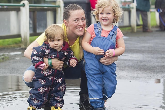 Cliodhna and Maisie Anderson from Peebles playing in the numerous puddles with Mum Abby