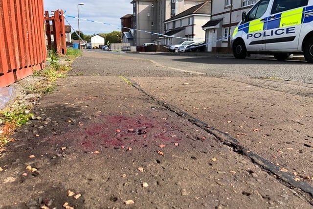Blood can clearly still be seen on the ground near where the incident took place