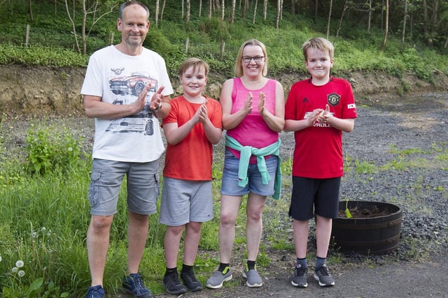 Anderson family from Galashiels, dad Richard, Gregor, Katie and Finlay stopping to support the carers during their daily excercise