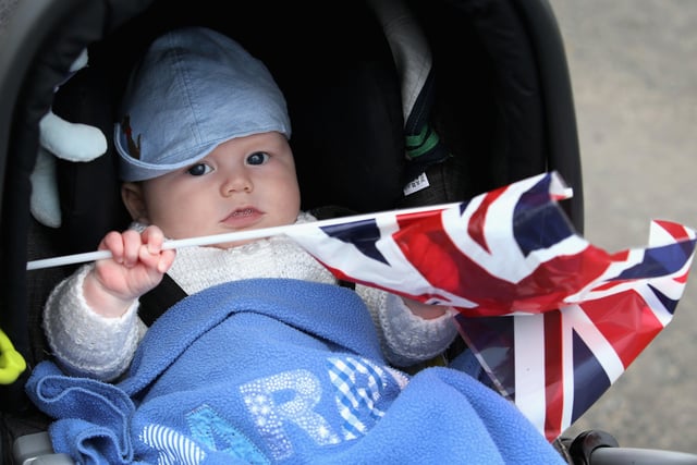 Four-month-old Harry Pettie waves his Union Jack as he waits for Queen Elizabeth II and Prince Philip, Duke of Edinburgh to arrive at Tweedbank Station on September 9, 2015.  (Photo by Chris Jackson/Getty Images)