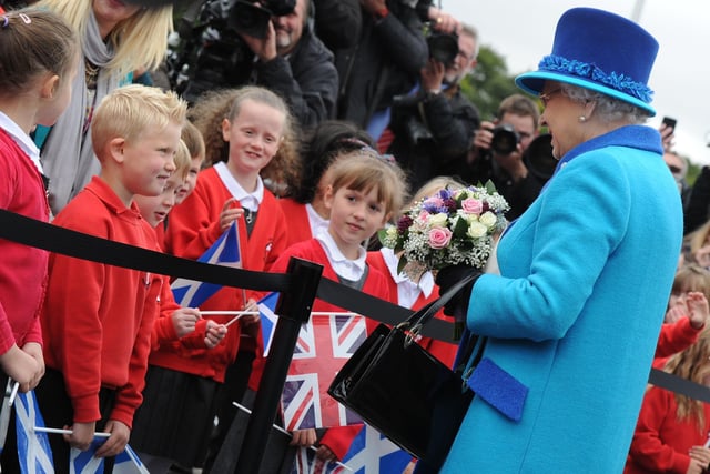 The Queen speaks to Tweedbank pupils after officially opening the Borders Railway. Photo: Kimberley Powell