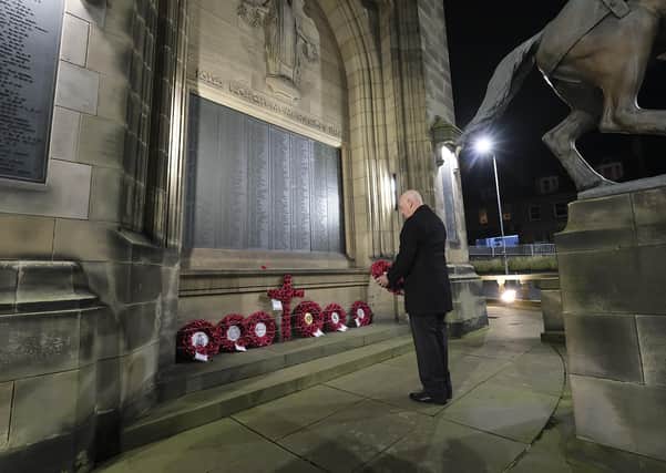 Galashiels councillor Harry Scott lays the Scottish Borders Council wreath at the town's war memorial at 5.30am today, November 11 ... the time the Allies met with representatives of the German government in 1918 to sign the Armistice agreement which brought to an end the fighting in the First World War. Photo: Sheila Scott