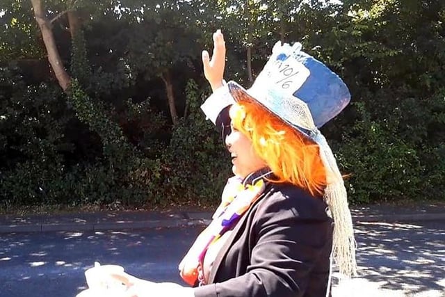 The Mad Hatter waving to passers by pvFOZEWB3B_hTOWfOAFm