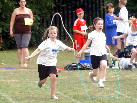 Children take part in a skipping race at Corby Old Village Primary School in July 2009. Photo by Doug Easton