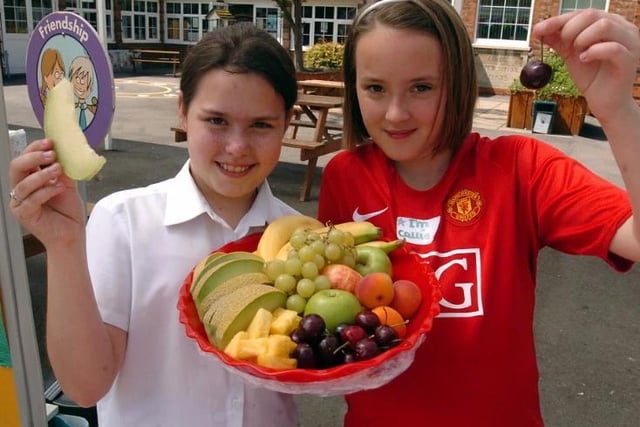 Sarah Rose and Callie Brock, then aged 11, eating healthily at Corby Old Village Primary School sports day in 2009. Photo by Alison Bagley