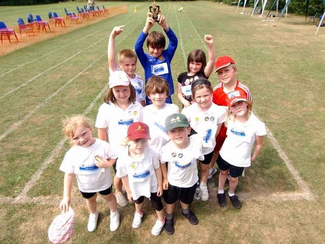 Corby Old Village Primary School celebrate their trophy at sports day in 2009. Photo by Doug Easton
