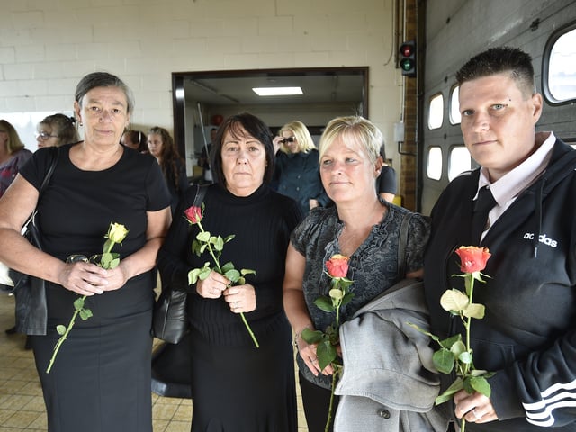 Mourners attend the funeral of Will Baker