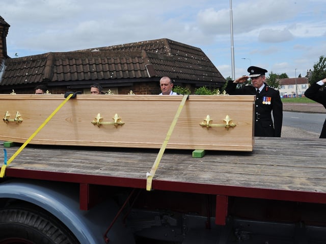 Mourners attend the funeral of Will Baker