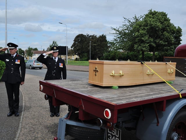 Mourners attend the funeral of Will Baker