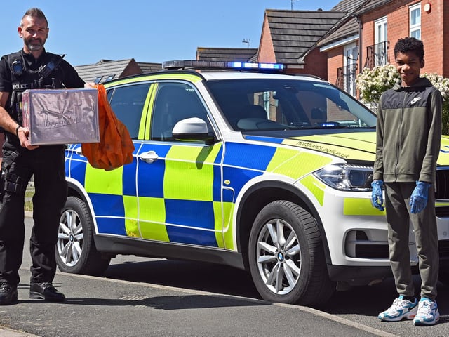 Northamptonshire Police joined forces with Wiltshire Police to help Northampton schoolboy, Cameron Douglas. Cameron had made PPE for his Grandmother but was unable to make the 70-mile trip to her care home in Wotton Basset to deliver it himself due to the lockdown restrictions. Cameron is pictured handing over the PPE to PC Jonathan Frame