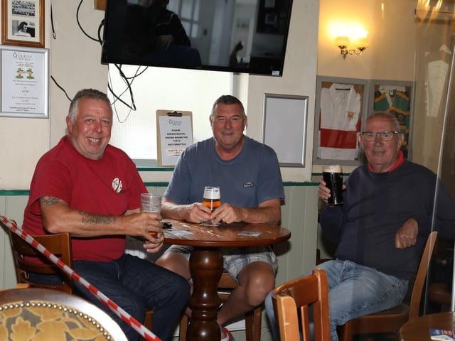 Enjoying a pint in The Queen's Head