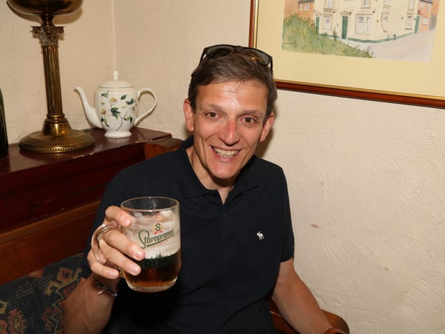 Enjoying a pint in The Queen's Head