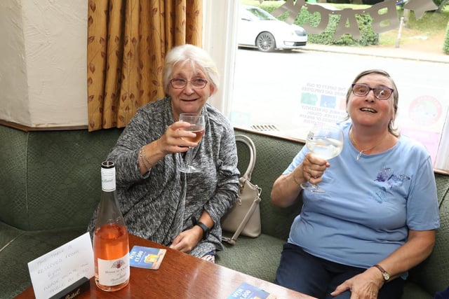 Friends Yve Thomson and Barbara Barnes enjoy a drink together